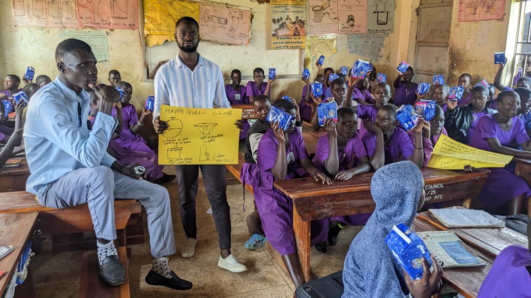 Happy Girls Club menstrual hygiene education session in progress with visual teaching aids